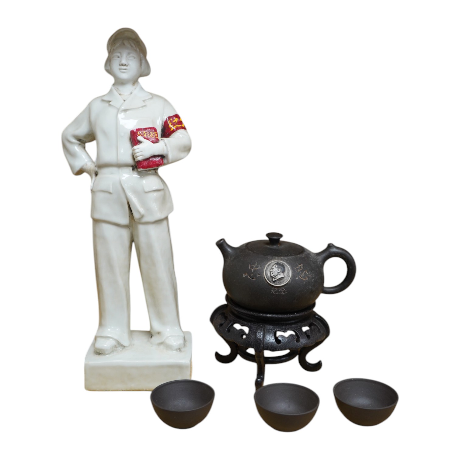 A Chinese cultural revolution Communist party figure together with a Mao teapot and three tea bowls, largest 31cm high. Condition - good